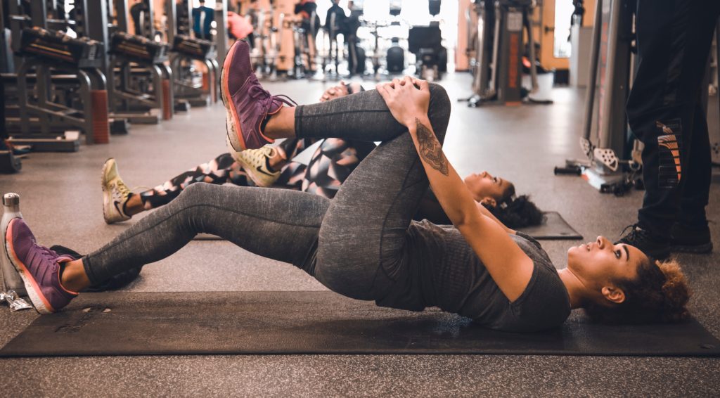 Relocating tips - Girl exercising and breaking out of her comfort zone. Joining a local gym can be a great way to make new friends and/or also raise your confidence, look and feel great. 